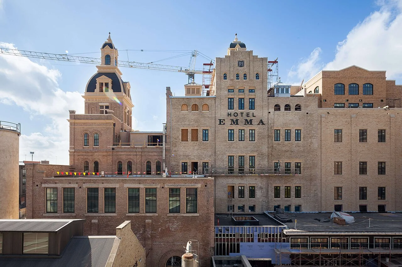 The Hotel Emma in the former Pearl brewery in San Antonio, with a tower crane working behind it