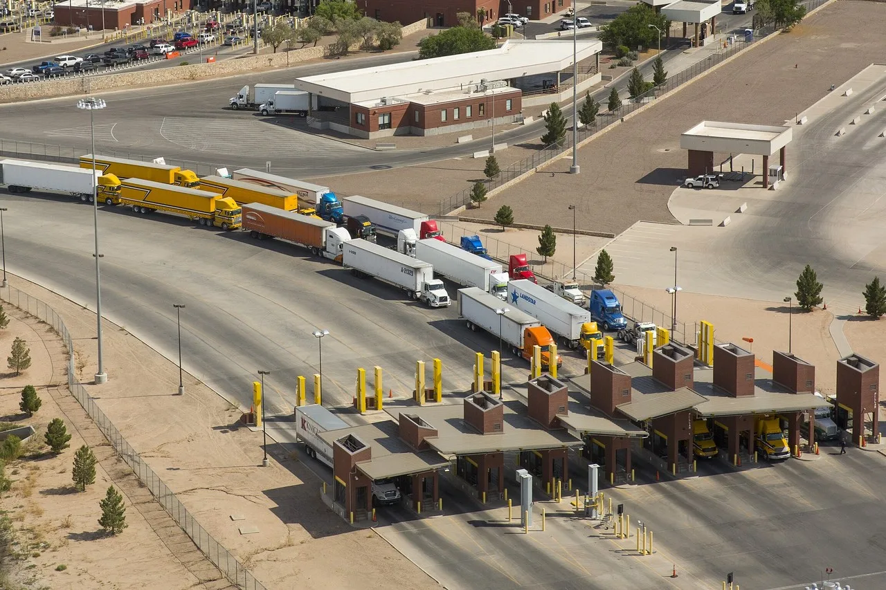 Tractor-trailers waiting at the truck inspection booths of the Ysleta port of entry near El Paso, seen from the air